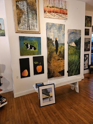 Gallery wall of framed local scenes